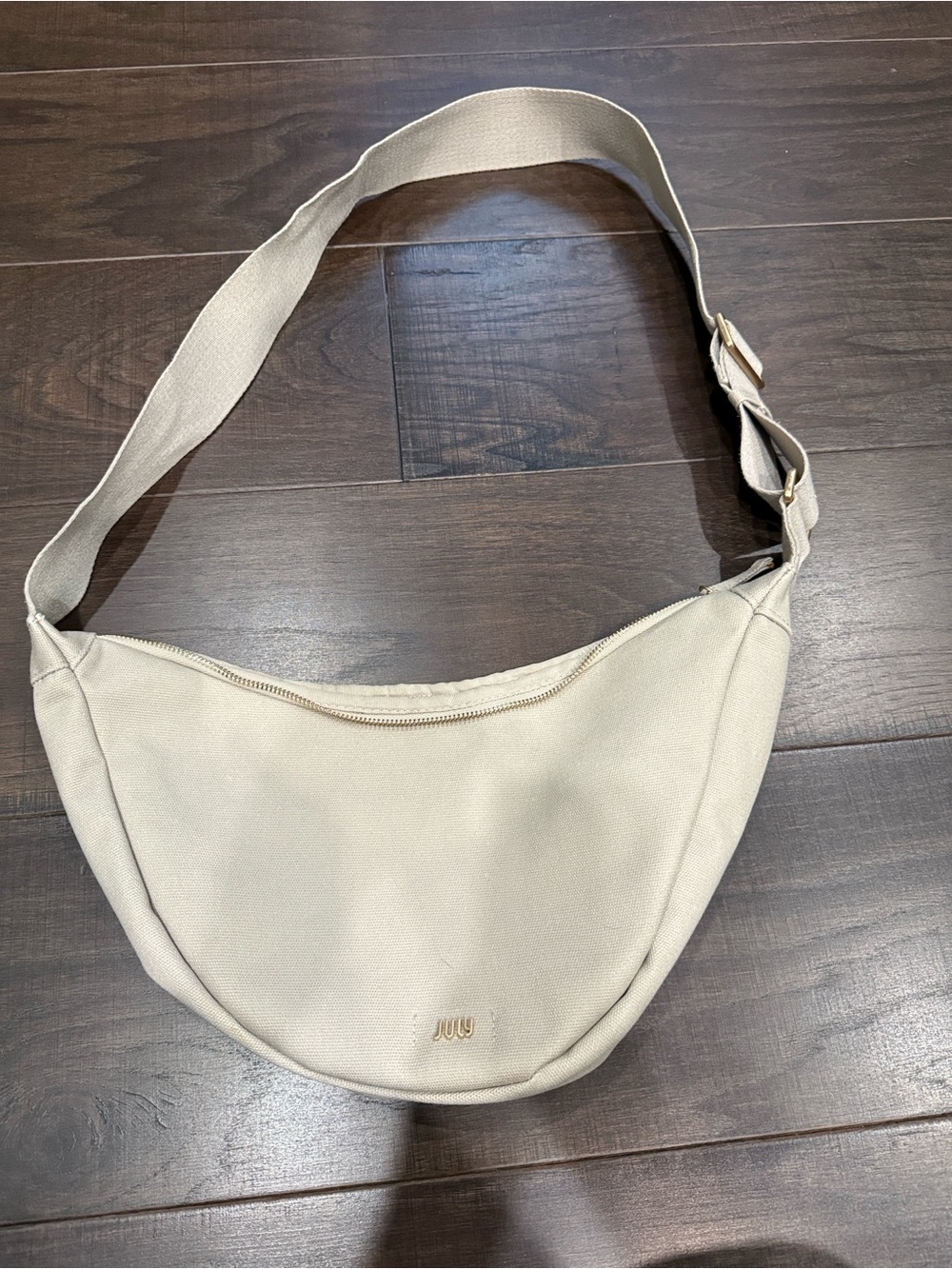 July Everyday Crescent Bag in a light canvas beige shade
